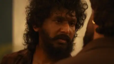 Still 1 of DC (2026) DS4K WEB-DL [Hindi (DD5.1) & Tamil] 4K 1080p 720p & 480p Dual Audio [x264/10Bit-HEVC] | [DC: The Bloody Valentine]